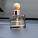 Fireball luxury car fragrance diffuser mounted on the dashboard using the included adhesive pad.