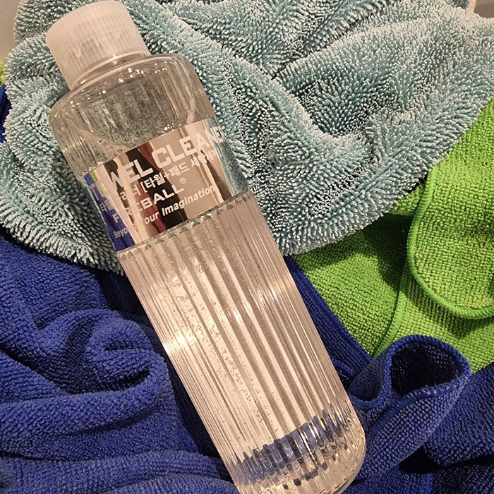 Fireball Towel Cleaner laying on basket of clean microfiber detailing towels after washing | lovecars