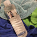 Fireball Towel Cleaner laying on basket of clean microfiber detailing towels after washing | lovecars