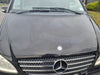 Smiley face pattern showing water spots removed from black van paint using Autostolz Water Spot Remover