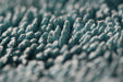 Close up of Rockcar Performer twisted loop microfiber weave teal and grey