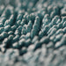 Close up of Rockcar Performer twisted loop microfiber weave teal and grey